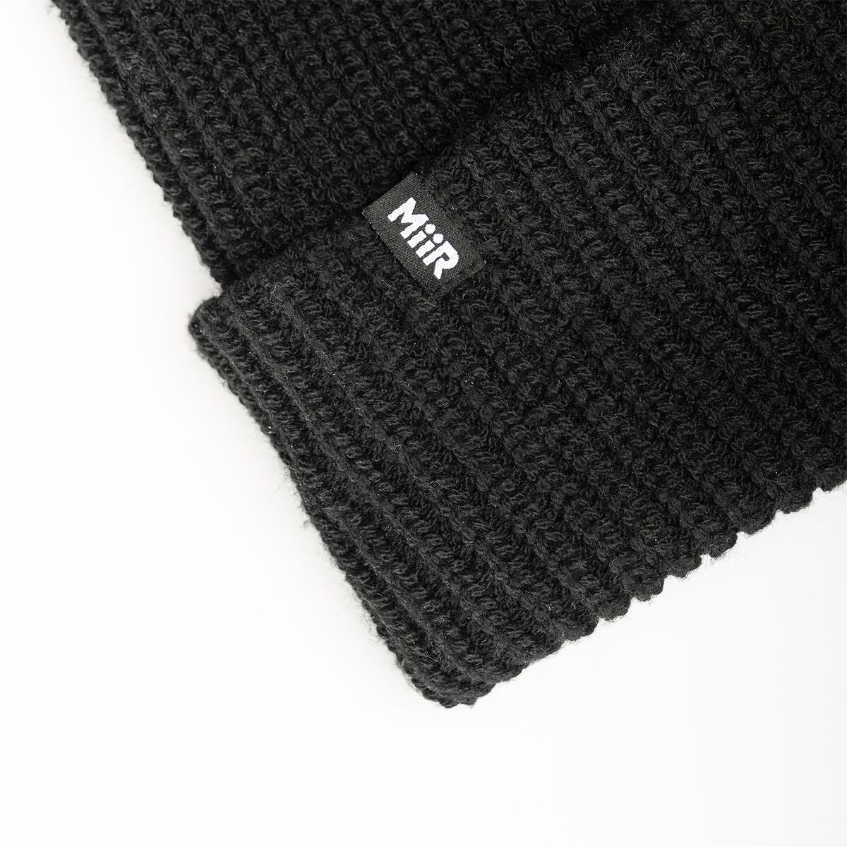 recycled-poly-rib-beanie-k9 WebPDP-RecycledPolyRibBeanie_Studio_TagDetail_Black__BNE002002OS.jpg